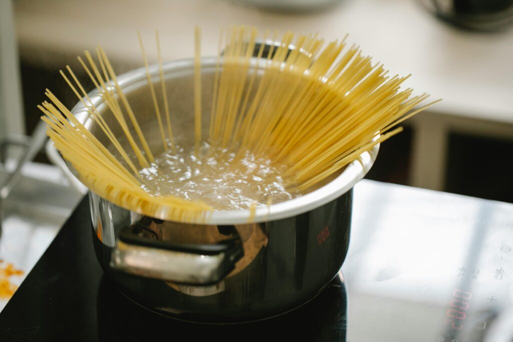 Small pot with not enough water for cooking pasta