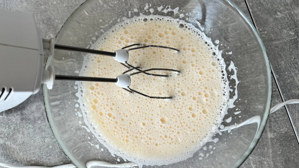 Whip the eggs, sugar and salt
